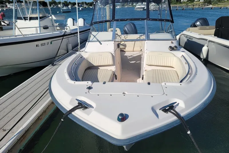 Slide: The Image of 2008 Grady-White Tournament 225 boat docked, featuring spacious seating and sleek design. - 10