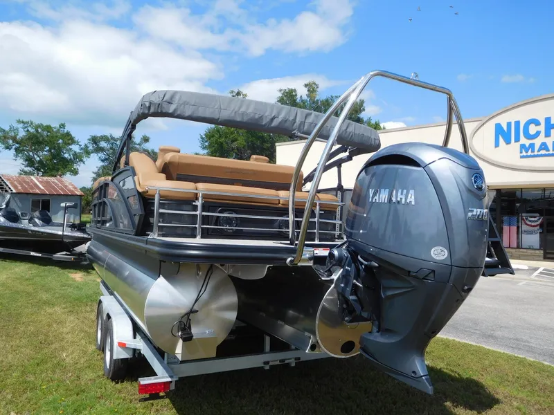 Slide: The Image of A 2026 Bennington 23 MSB pontoon boat on a trailer. It features a Yamaha outboard motor. - 3