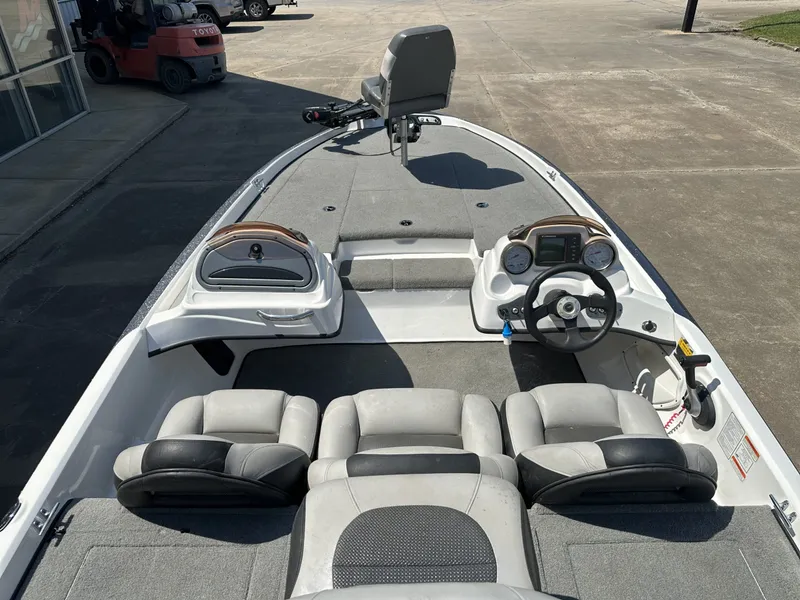 Slide: The Image of The image shows the cockpit of a 2008 Nitro Z-7 boat with gray seats and a steering console. - 4