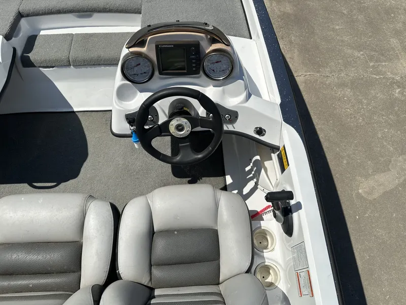 Slide: The Image of The image shows the cockpit of a 2008 Nitro Z-7 boat with gray seats and a steering wheel. - 5