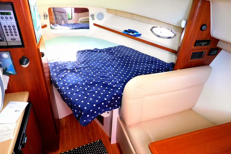 Slide: The Image of Interior cabin of 2004 Tiara Yachts 2900 Open Classic with polka dot bedding. - 18