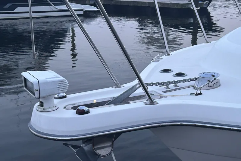 Slide: The Image of Bow of a 2004 Tiara 2900 boat with anchor and spotlight in marina. - 14