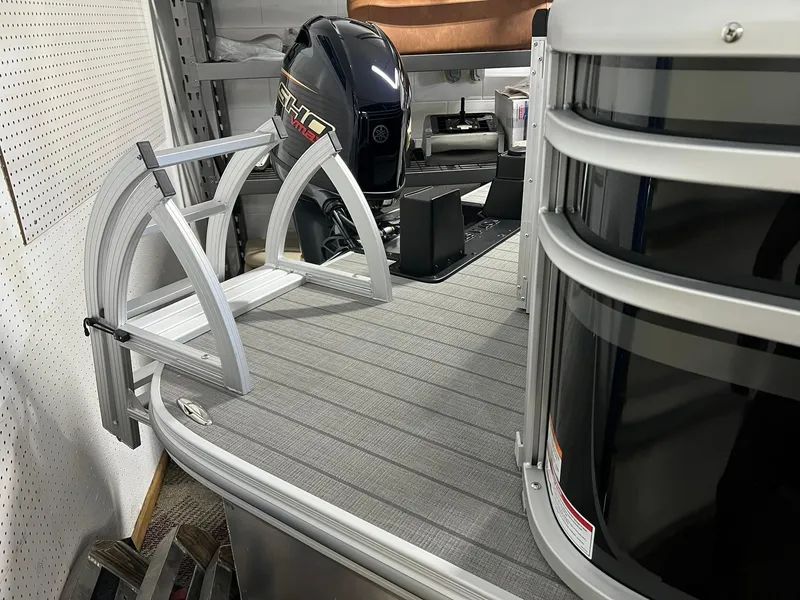 Slide: The Image of 2025 SunCatcher Select 20RC pontoon boat with sleek design and modern features. - 7