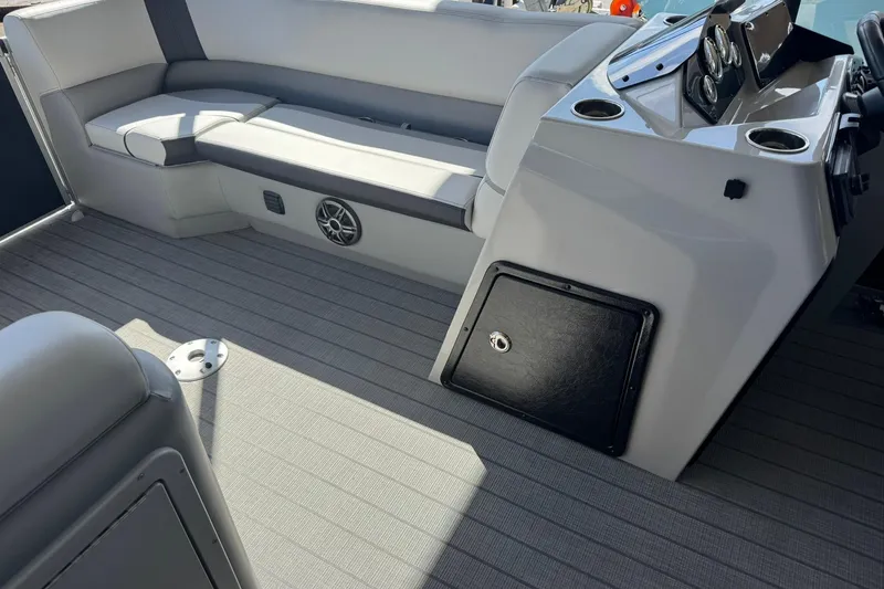 Slide: The Image of Interior of 2025 SunCatcher Select 20RC boat with seating and control panel. - 4