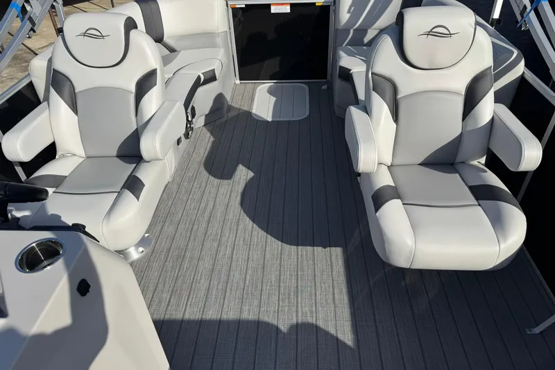 Slide: The Image of 2025 SunCatcher Select 20RC boat interior with plush gray seating and modern design. - 12
