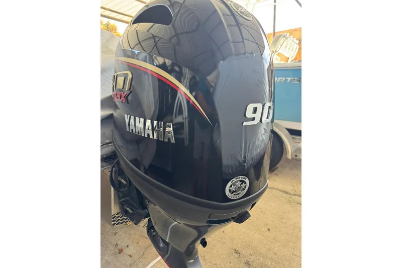 Slide: The Image of Yamaha 90 horsepower outboard motor on a 2025 SunCatcher Select 20RC boat. - 6