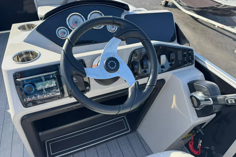 Slide: The Image of Steering console of 2025 SunCatcher Select 20RC boat with gauges and controls. - 11