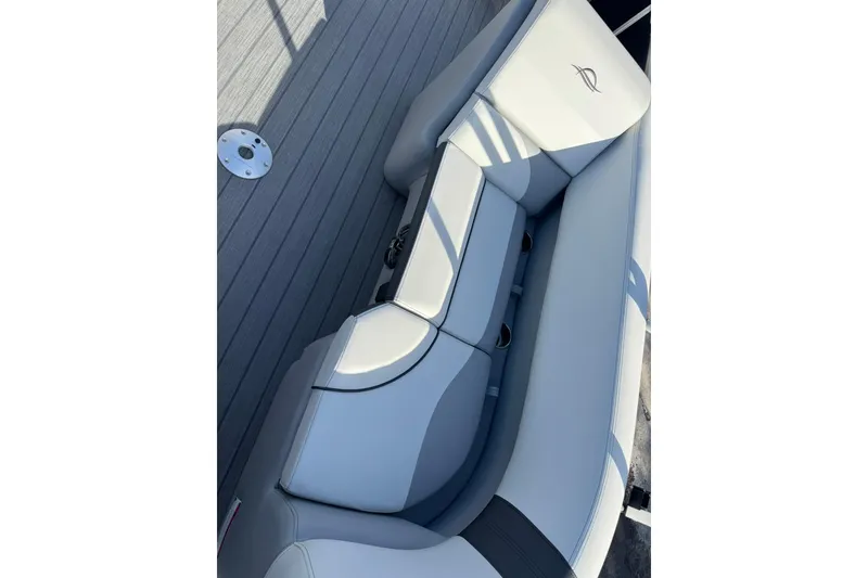 Slide: The Image of 2025 SunCatcher Select 20RC boat interior with sleek, modern seating design. - 14