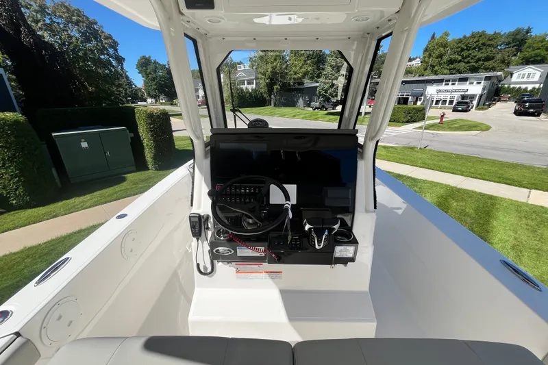 Slide: The Image of Interior view of 2027 Pursuit S 268 Sport boat cockpit with steering and controls. - 4