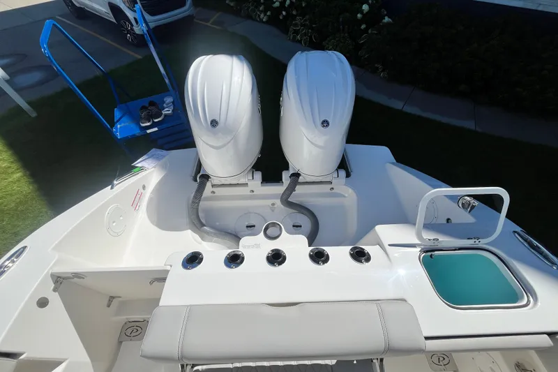 Slide: The Image of 2027 Pursuit S 268 Sport boat with dual outboard engines and sleek deck design. - 6
