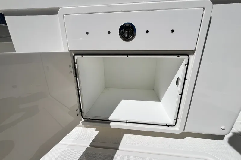 Slide: The Image of Open storage compartment on 2027 Pursuit S 268 Sport boat. - 7