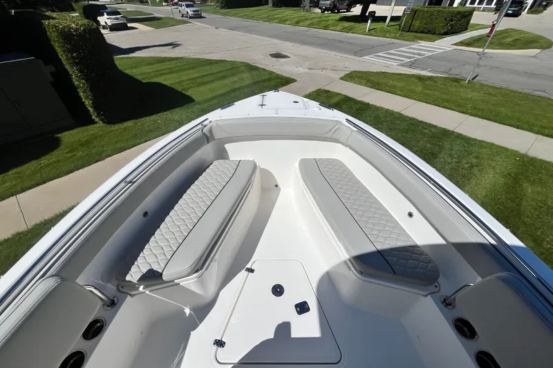 Slide: The Image of 2027 Pursuit S 268 Sport boat interior with cushioned seating and sleek design. - 10