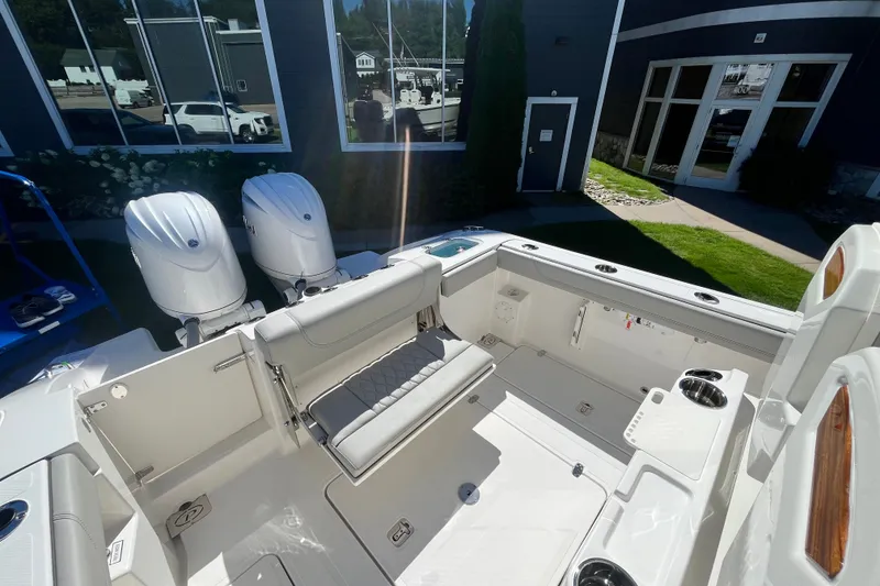 Slide: The Image of 2027 Pursuit S 268 Sport boat interior with dual engines and seating area. - 5