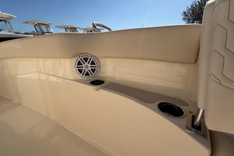 Slide: The Image of 2027 Scout 220 XSF boat interior with speaker and cup holders. - 25
