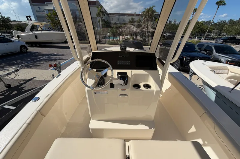 Slide: The Image of 2027 Scout 220 XSF boat cockpit with steering wheel and control panel. - 17