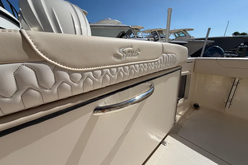 Slide: The Image of 2027 Scout 220 XSF boat interior with embossed logo and elegant upholstery design. - 9