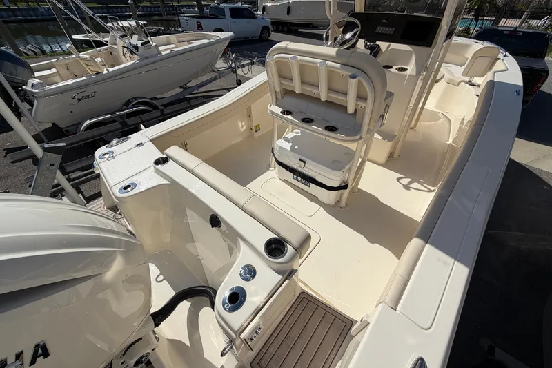 Slide: The Image of 2027 Scout 220 XSF boat interior with Yamaha engine, showcasing seating and console. - 6