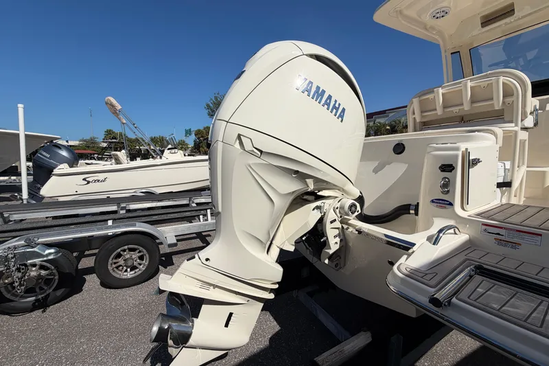 Slide: The Image of 2027 Scout 220 XSF boat with Yamaha outboard motor on trailer. - 5