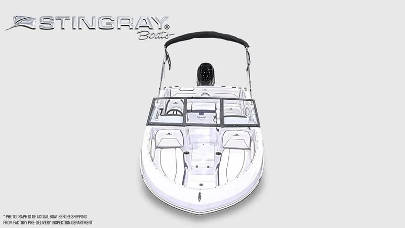 Slide: The Image of A modern Stingray 172 DC boat with an open deck and black Bimini top. - 6