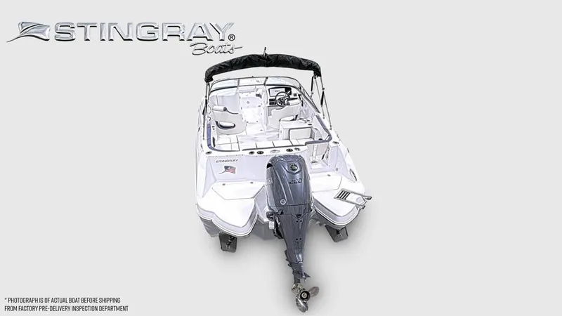 Slide: The Image of The image shows a white Stingray 231 DC boat with an outboard motor. - 3