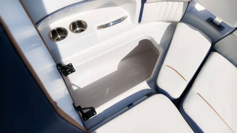 Slide: The Image of Interior of the 2027 Stingray 231 DC with white upholstery and cup holders. - 14