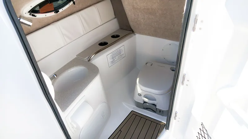 Slide: The Image of Interior of the 2027 Stingray 231 DC featuring a toilet and sink. - 17