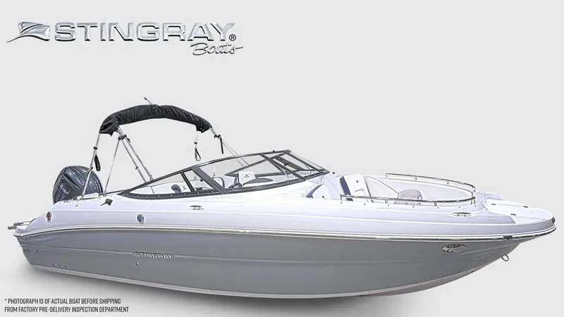Slide: The Image of The image shows a modern Stingray 231 DC boat with a gray hull and black bimini top. - 8