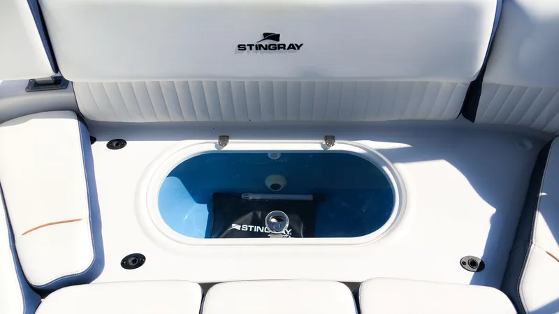 Slide: The Image of The image shows the interior of a Stingray 231 DC boat with a built-in blue compartment. - 15