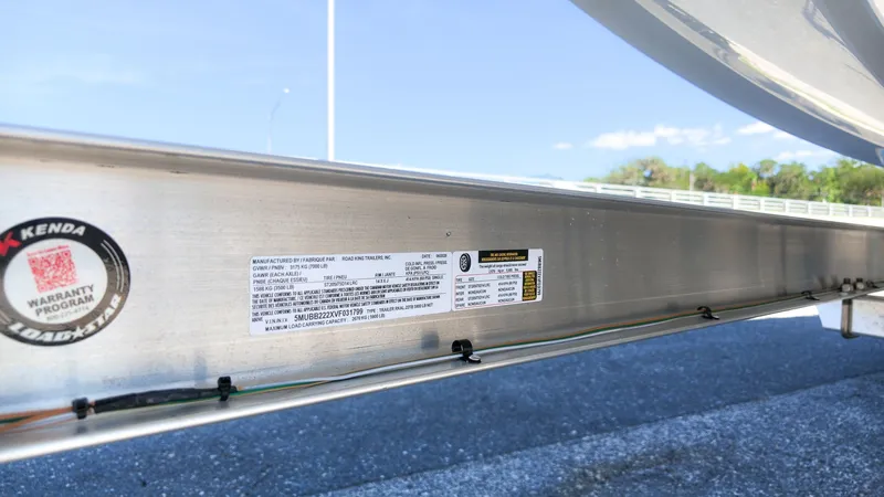 Slide: The Image of Close-up of a boat trailer with manufacturer label and wiring. - 10
