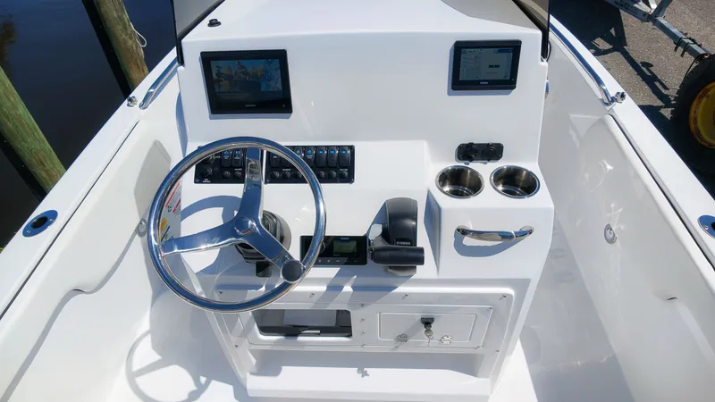 Slide: The Image of The image shows the cockpit of a 2027 Stingray 173 CC boat with a modern helm station. - 9