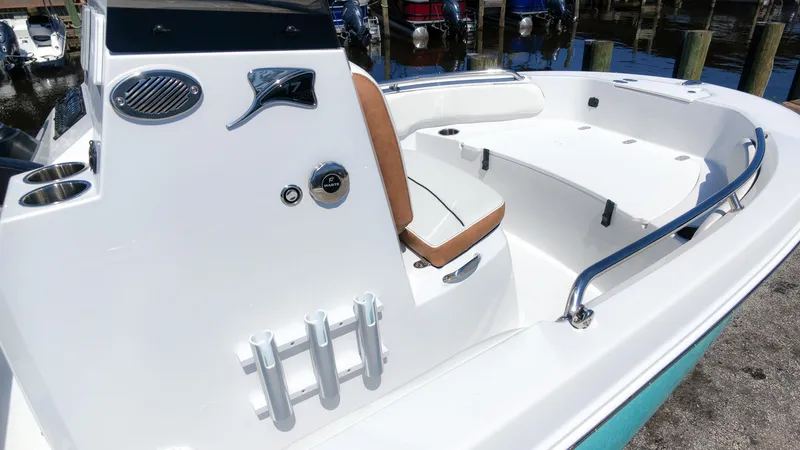 Slide: The Image of The image shows the cockpit of a 2027 Stingray 173 CC boat with white seating and stainless steel railings. - 5