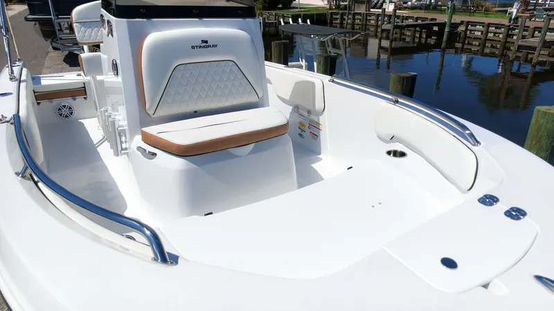 Slide: The Image of The image shows the cockpit of a 2027 Stingray 173 CC boat with sleek upholstery. - 6