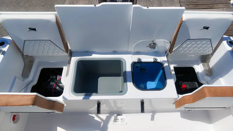 Slide: The Image of The image shows the stern of a Stingray 173 CC boat with multiple storage compartments and a sink. - 8