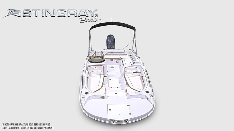 Slide: The Image of The image shows a Stingray 192 SC boat with an open deck and a Bimini top. - 7