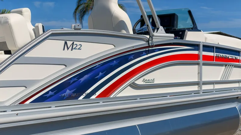 Slide: The Image of A Bennington 22 M Swingback pontoon boat with patriotic design and comfortable seating. - 4