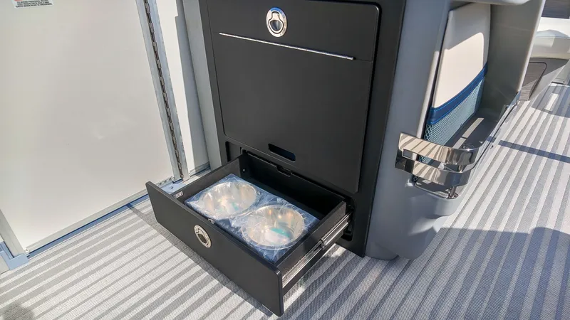 Slide: The Image of An open drawer cabinet on a boat reveals two round containers. - 14