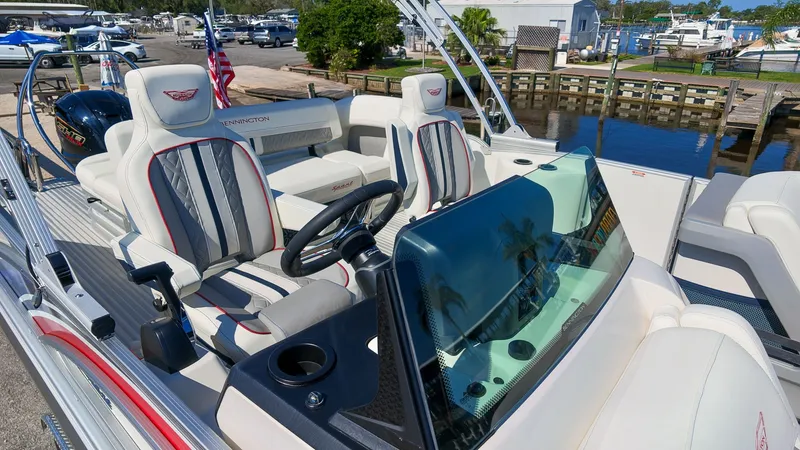 Slide: The Image of Bennington 22 M Swingback 2027: Luxurious pontoon boat with stylish seating and modern helm. - 28