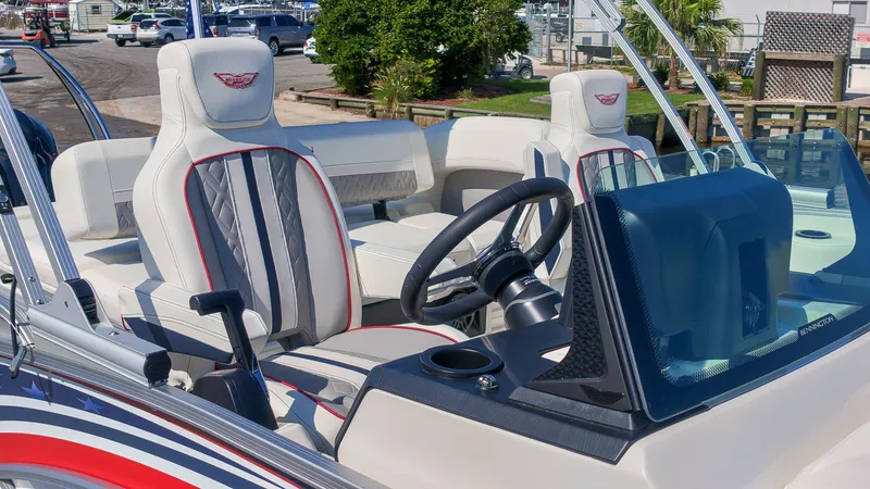 Slide: The Image of The image shows the cockpit of a 2027 Bennington 22 M Swingback with stylish seats and a modern helm. - 27