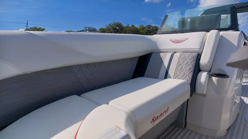 Slide: The Image of The image shows the luxurious interior of a 2027 Bennington 22 M Swingback with elegant seating. - 21