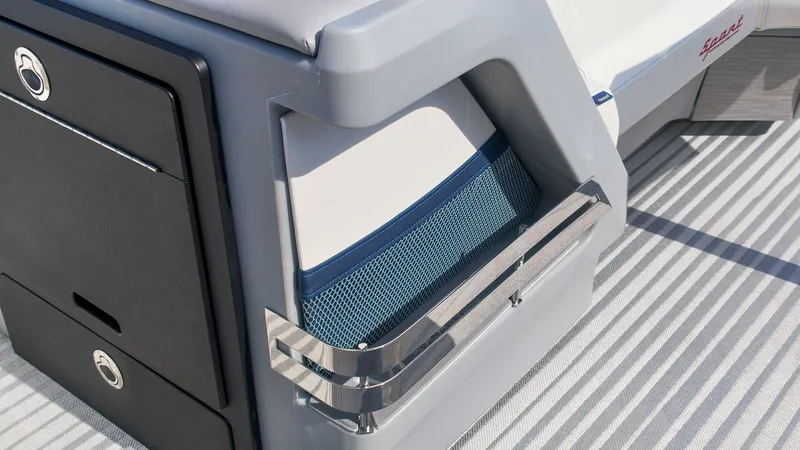 Slide: The Image of Close-up of a modern boat with gray and white design, mesh storage, and metal railing. - 18