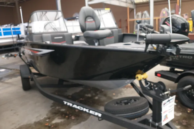 The Image of 2026 Tracker Pro Guide V-175 WT boat on trailer, displayed in showroom. - 0