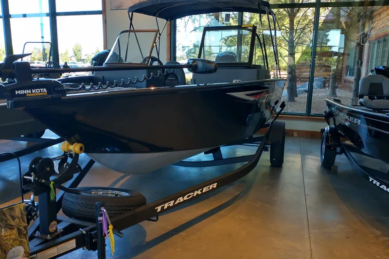 The Image of 2026 Tracker Pro Guide V-175 WT boat displayed indoors with Minn Kota PowerDrive motor. - 0