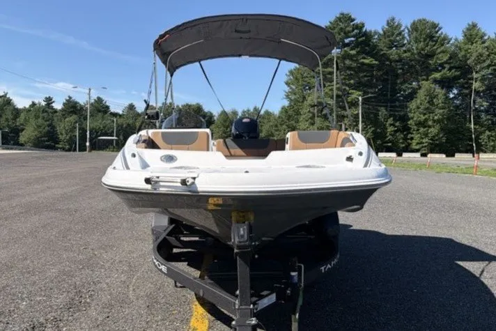 Slide: The Image of Front view of a 2026 Tahoe 1950 boat on a trailer, parked outdoors. - 6