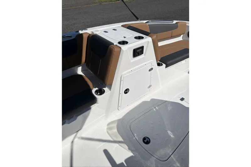 Slide: The Image of Interior of 2026 Tahoe 1950 boat with brown seating and storage compartments. - 10