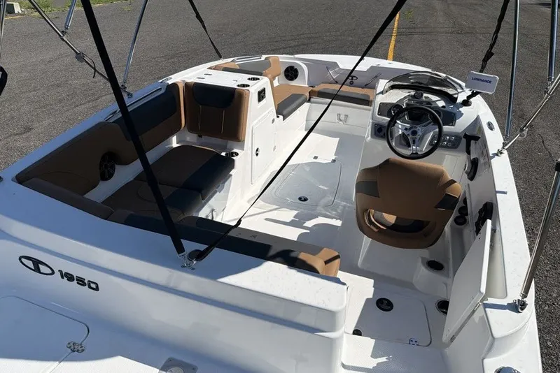 Slide: The Image of 2026 Tahoe 1950 boat interior with seating, steering wheel, and modern dashboard. - 8