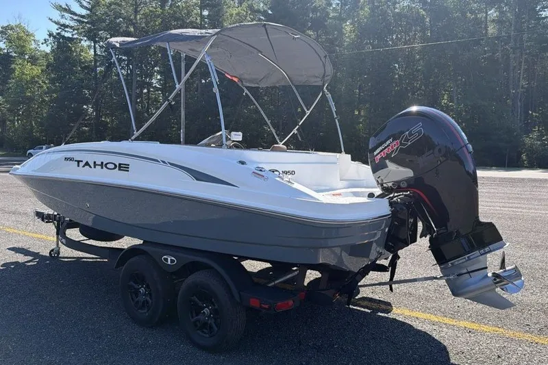 Slide: The Image of 2026 Tahoe 1950 boat with Mercury Pro XS engine on trailer in sunny outdoor setting. - 5