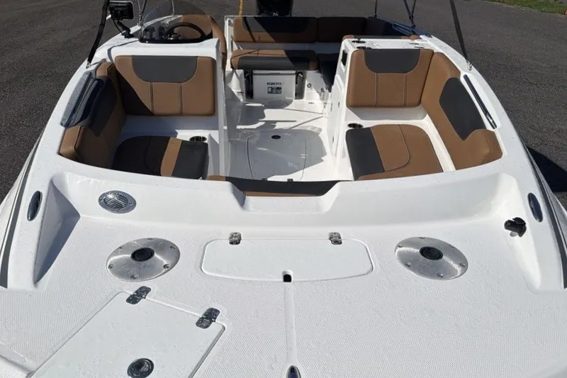 Slide: The Image of 2026 Tahoe 1950 boat interior with tan and gray seating, spacious layout. - 7