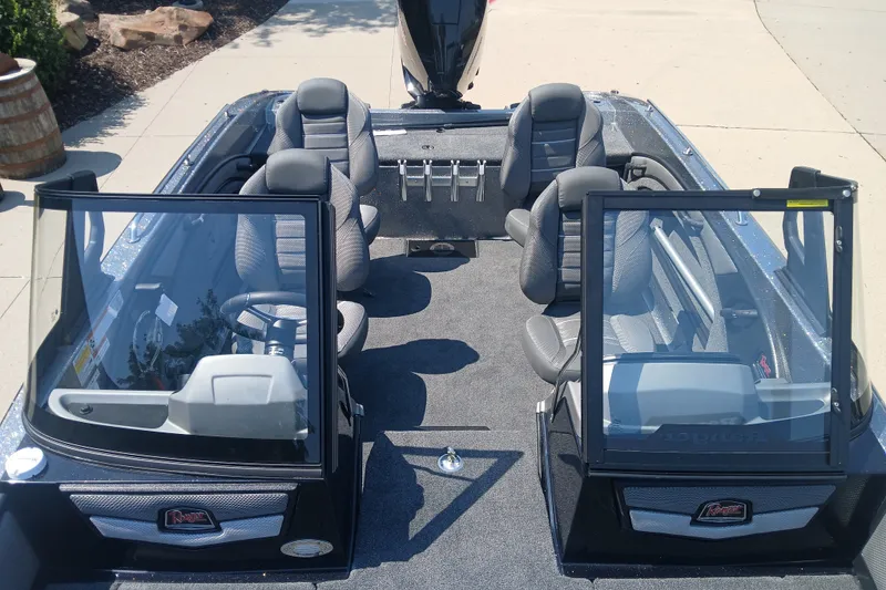 Slide: The Image of 2026 Ranger 1880MS boat interior with seating and steering console. - 4