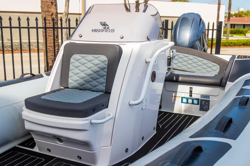 Slide: The Image of 2024 Highfield Sport 520 boat interior with cushioned seating and modern design. - 17
