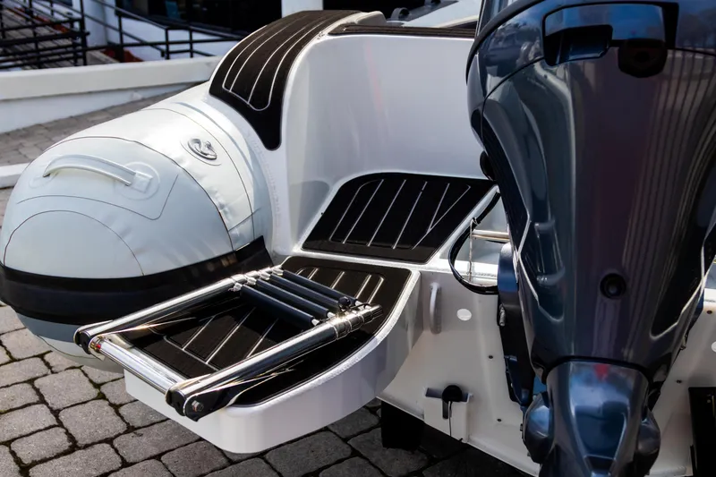 Slide: The Image of 2024 Highfield Sport 520 boat with motor and swim platform, featuring sleek design and modern features. - 23